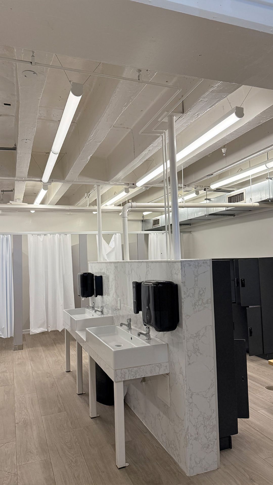Newly installed lighting in a commercial restroom in Oakland, CA